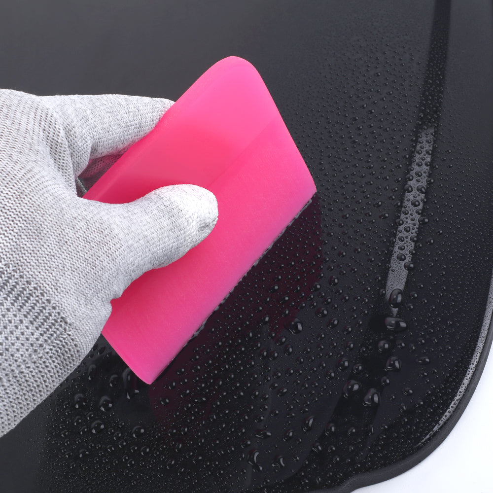 Assortment of pink round edge PPF squeegees, demonstrating the range of sizes for versatile film application needs.