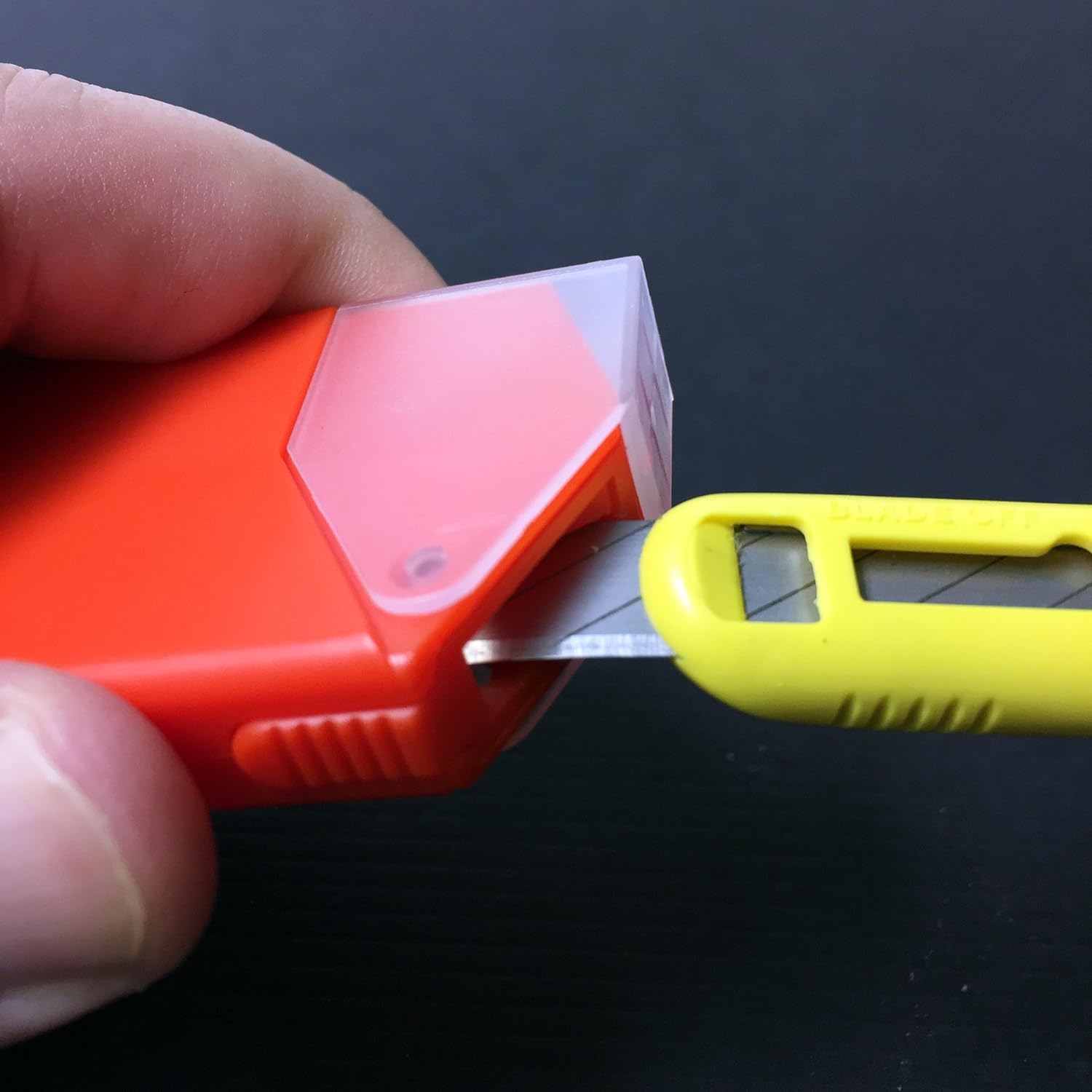 Detailed view of NT Cutter 9mm Snap-Off Blades in action, highlighting the clean cuts on different surfaces.