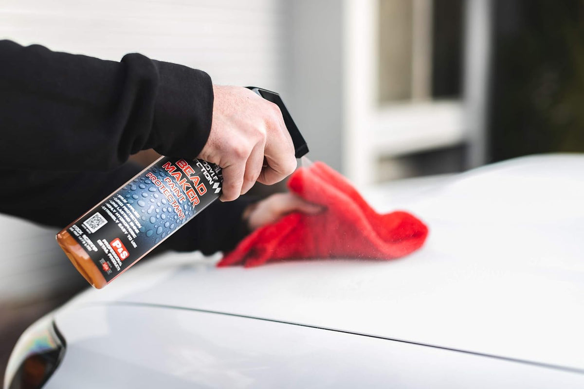 Vehicle undergoing treatment with P&S Bead Maker Paint Protectant, highlighting the stunning, water-beading effect on the paint surface.