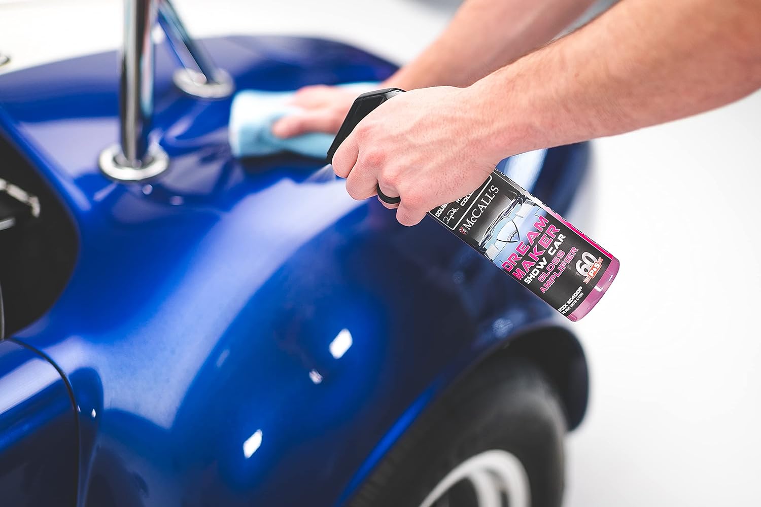 Close-up of P&S Dream Maker being sprayed onto a vehicle's surface, illustrating the fine mist for even application.