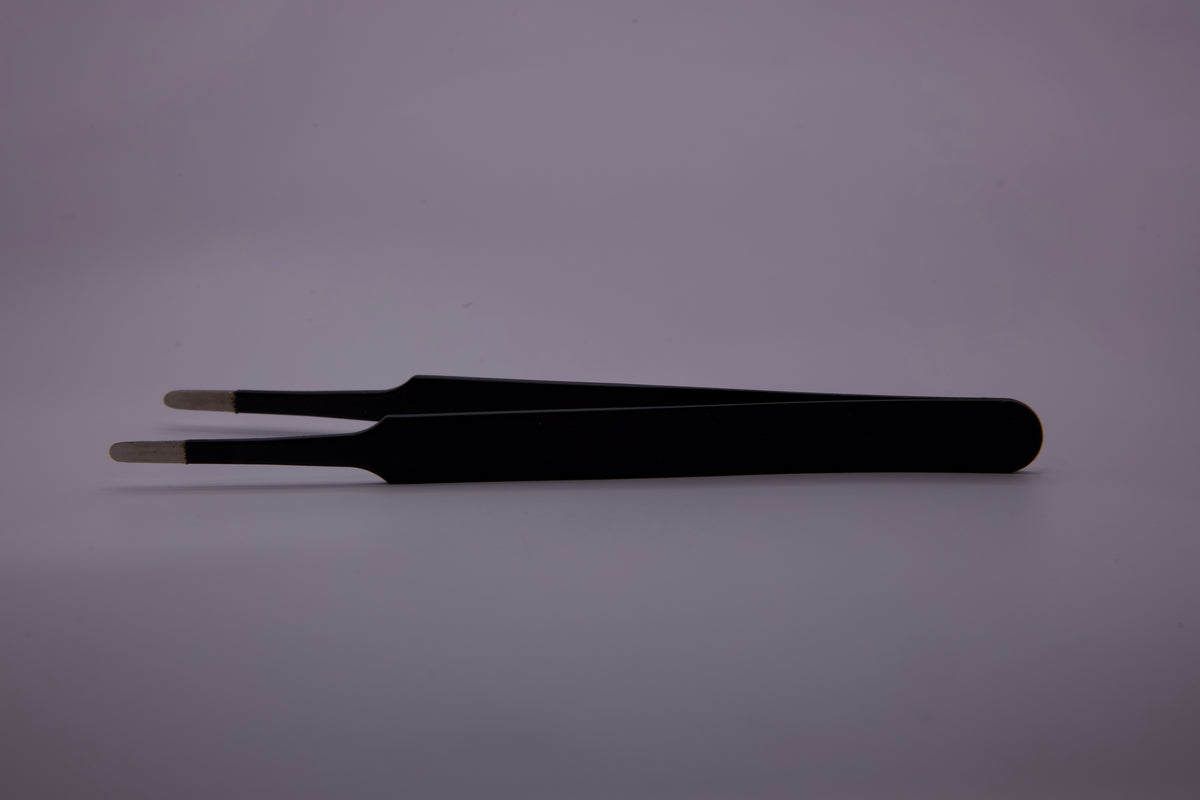 Precision Tweezers being used for precise weeding on vinyl graphics.
