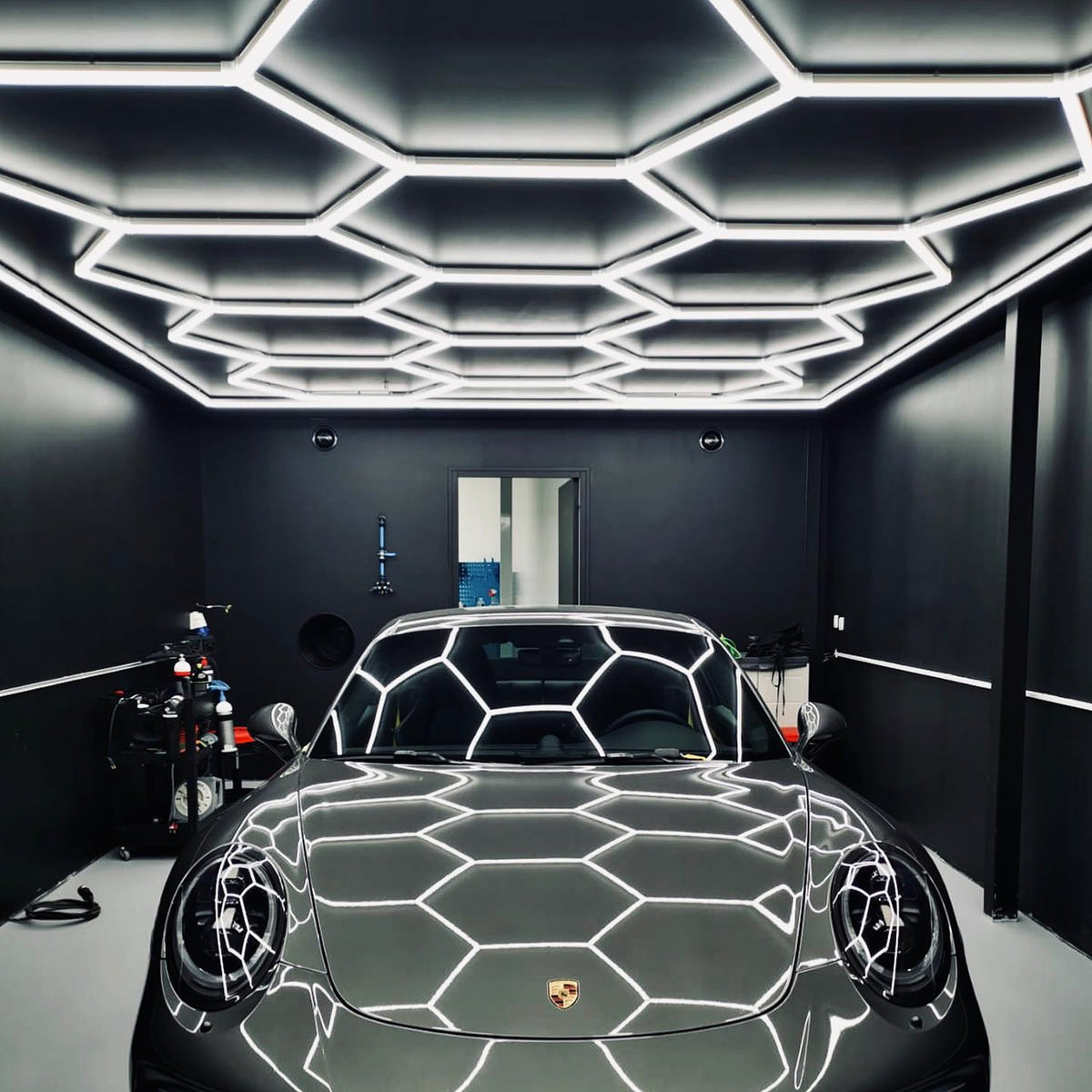 Detailed view of the Vortex Hexa LED Light ST1028 installation in a contemporary garage setting.