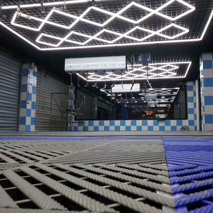 The Vortex Hexa LED Light ST2018 casting bright, energy-efficient light in a modern garage.