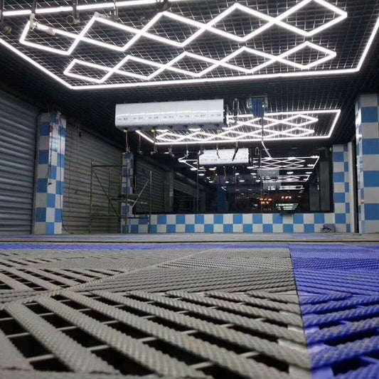 The Vortex Hexa LED Light ST2018 casting bright, energy-efficient light in a modern garage.